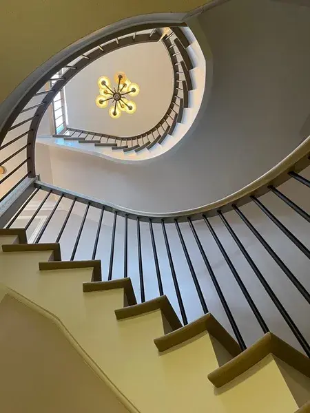 Looking up a newly renovated double spiral staircase Looking up a newly renovated double spiral staircase